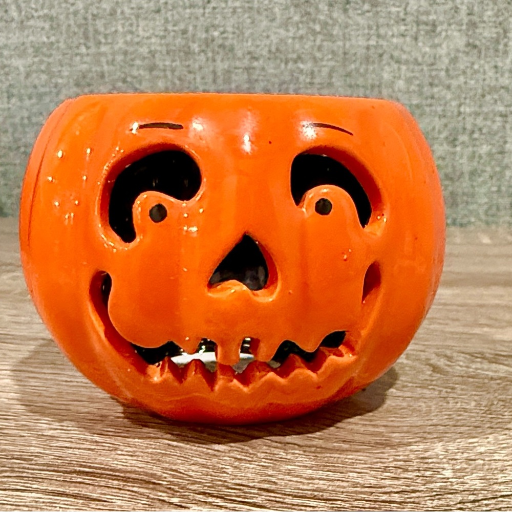 Adorable pumpkin, painted porcelain votive candle holder. Halloween decor